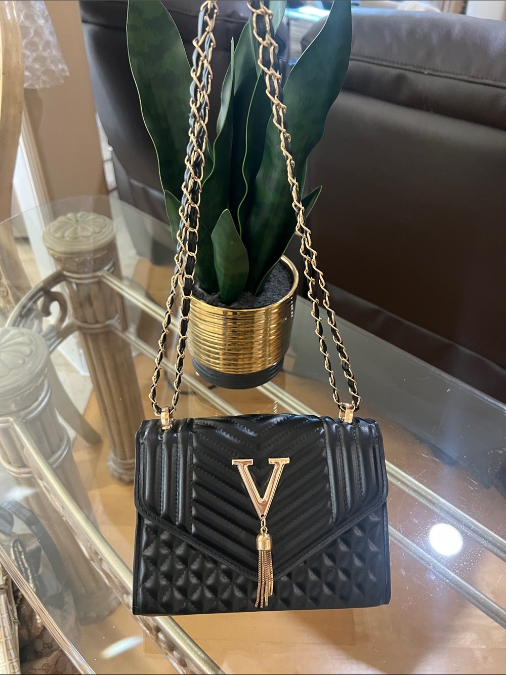 Black Quilted Shoulder Bag with Gold V Tassel Accent